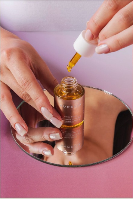 Product photography — serum dropper over mirror